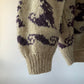 Pull en laine épaisse avec capuche et motif
